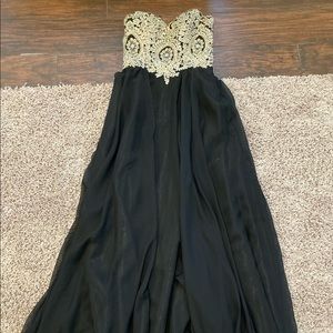 Strapless evening gown with gold/silver sweetheart beaded top.